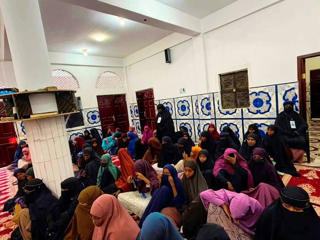 Women attending an educational lecture at Mama Habiba School